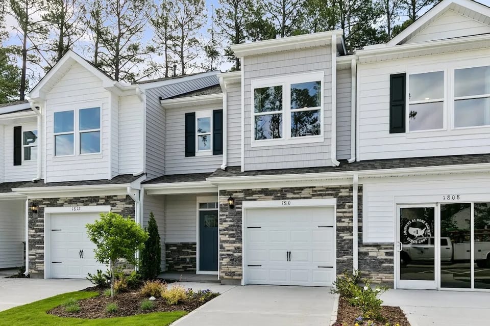 Copper Run North, Durham, North Carolina: two-storey townhomes with stone accents and single-car garages