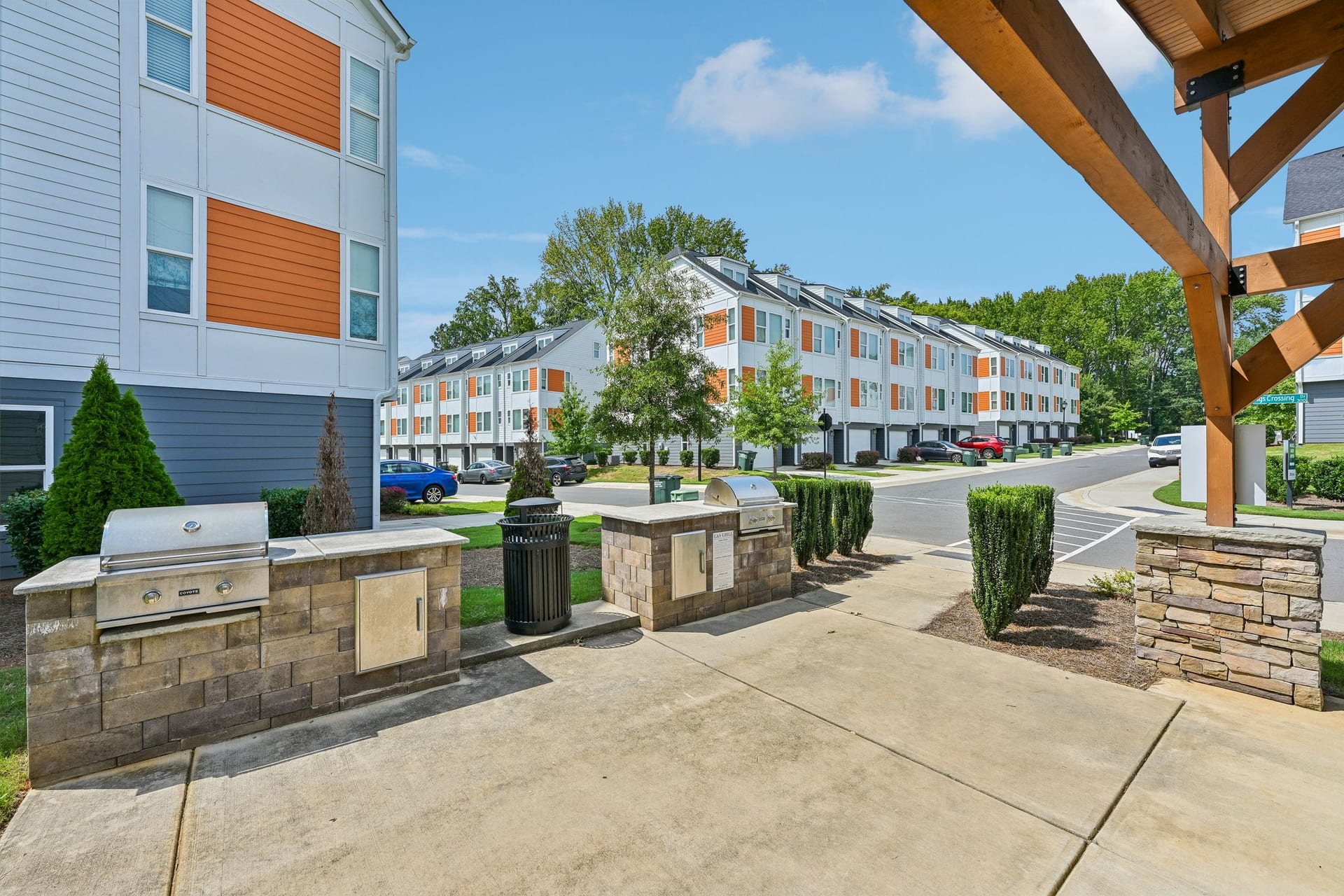 Crossings at NoDa: outdoor grill under the pavilion facing the townhomes