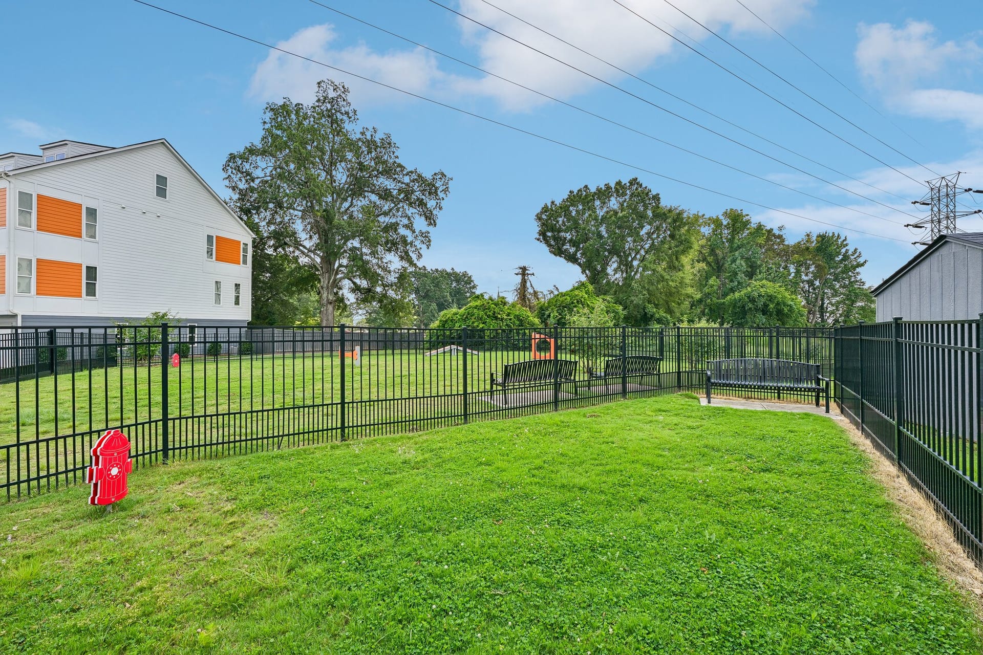 Crossings at NoDa: fenced dog park with a bench