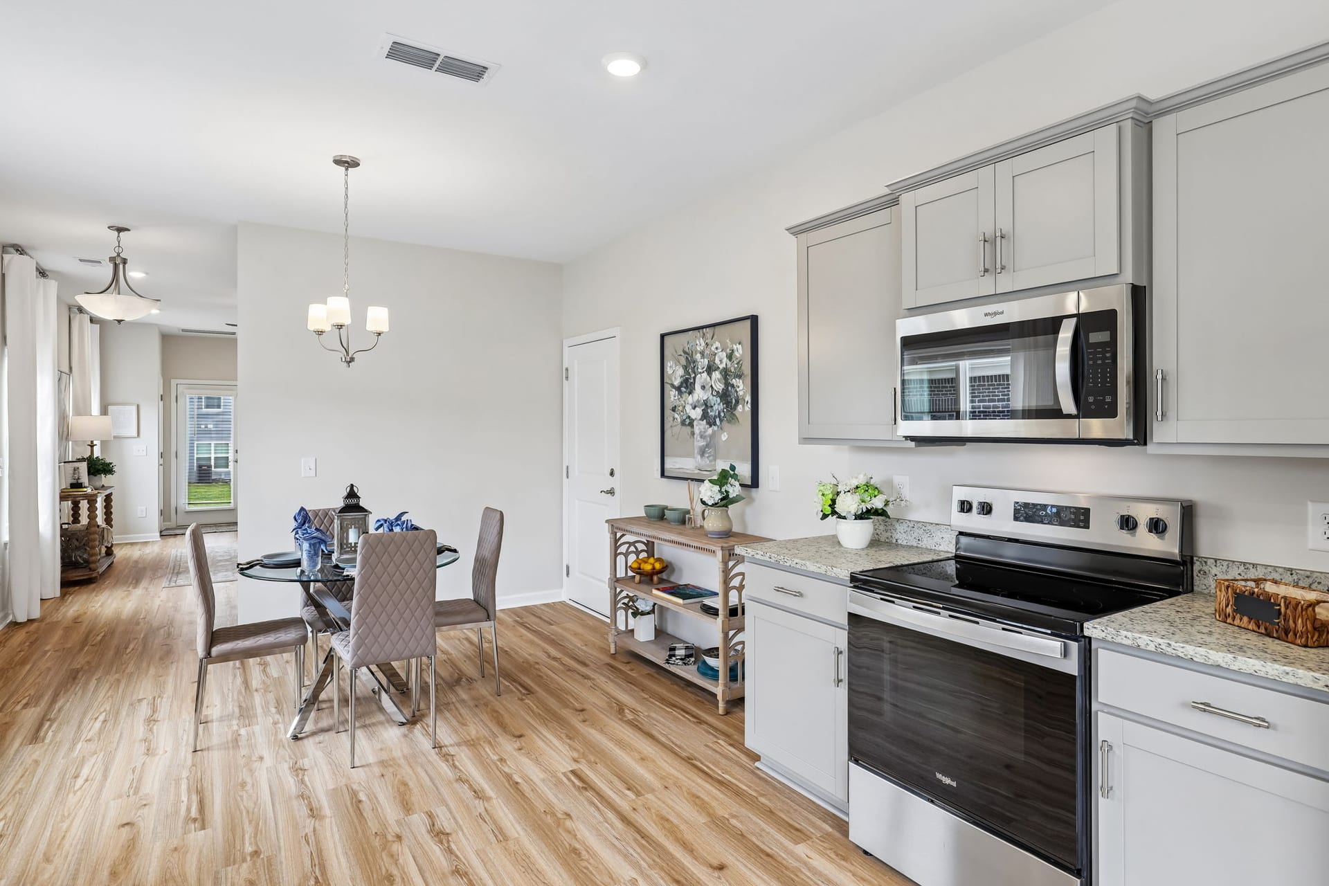 Harts Branch Townhomes: kitchen and dining area with white cabinets