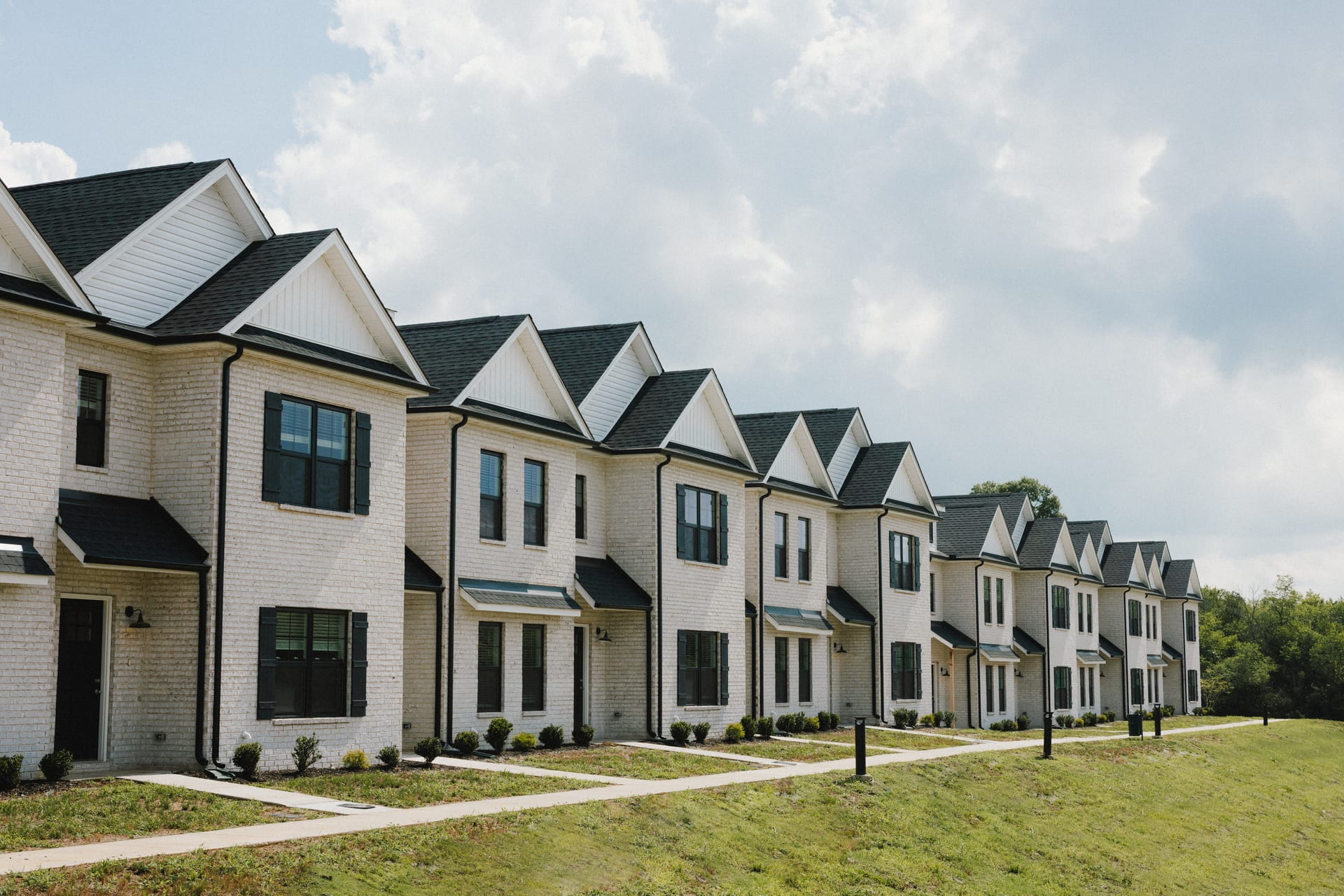 Legends Townhomes: row of townhome fronts along the street
