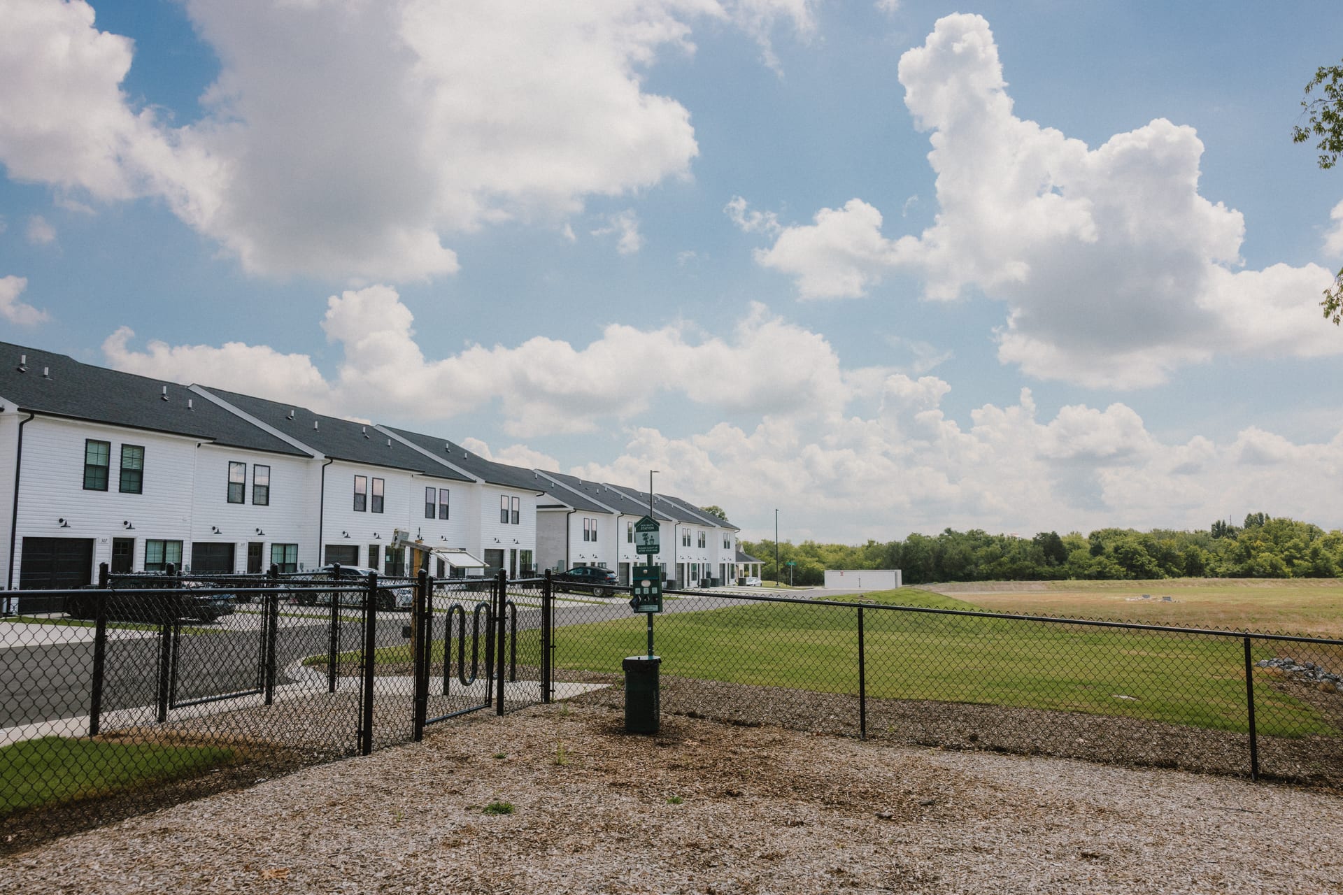 Legends Townhomes: fenced dog park beside the townhomes