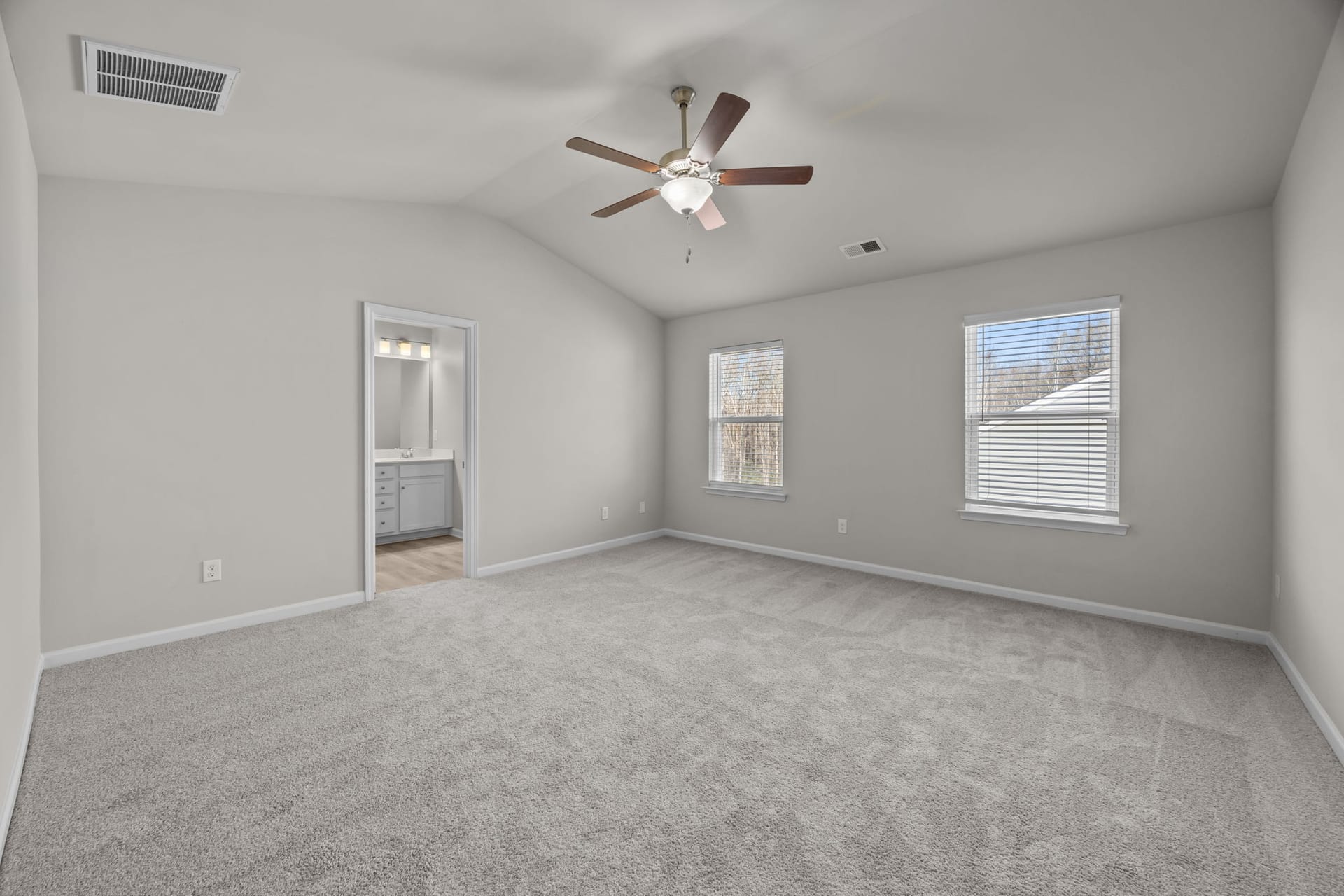 The Grove Residences: bedroom with a vaulted ceiling