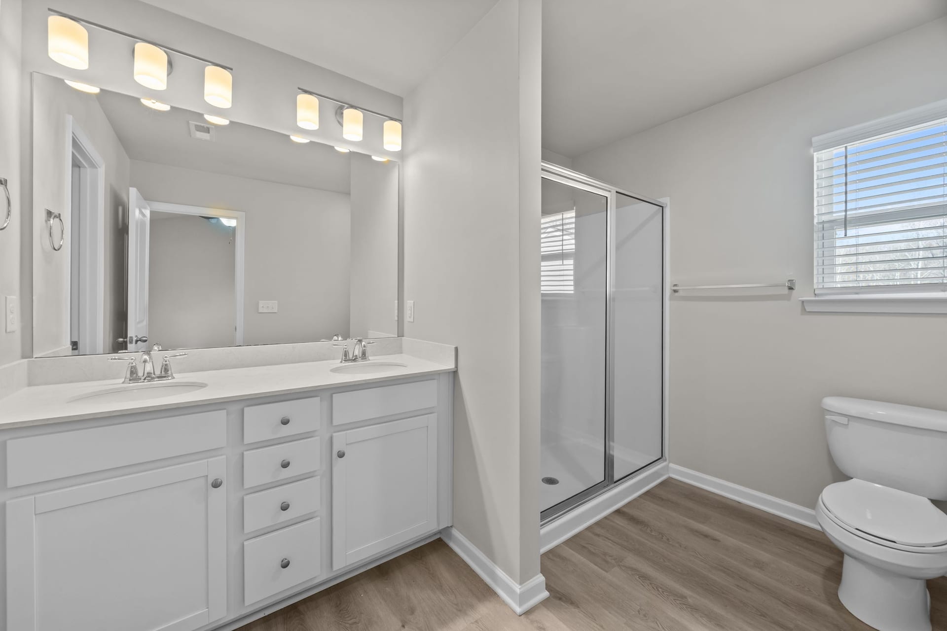 The Grove Residences: bathroom with a double vanity and a walk-in shower
