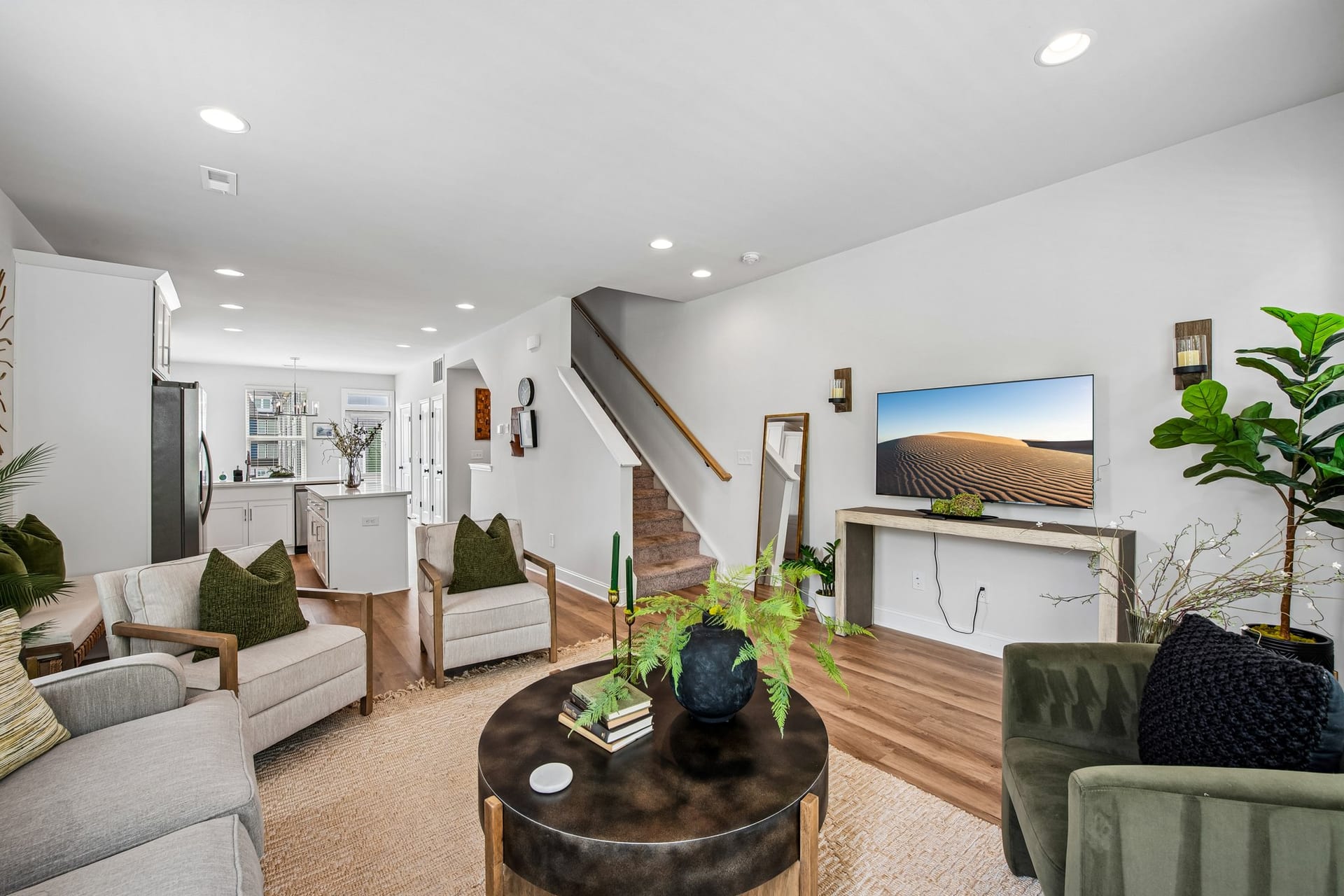 Towns at Eastland: living room with the kitchen and staircase beyond