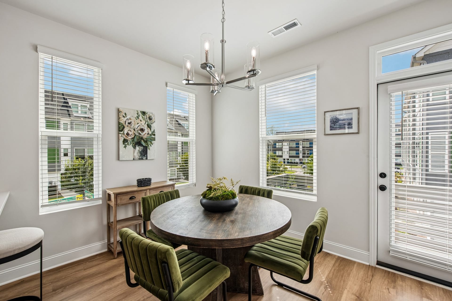 Towns at Eastland: dining area with a round table beside the windows